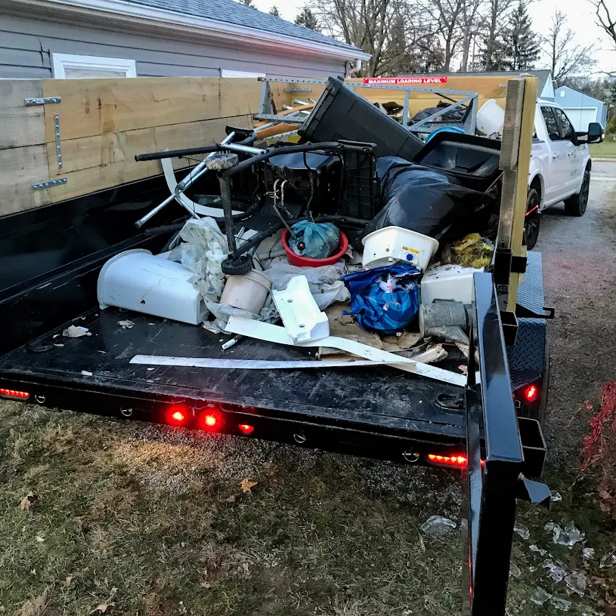 Roll-off dumpster delivered to a residential driveway in Riviera Beach